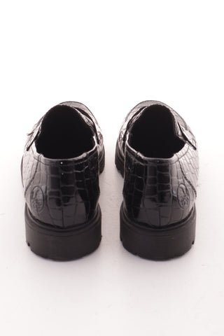Schwarze Schuhe aus Lackleder